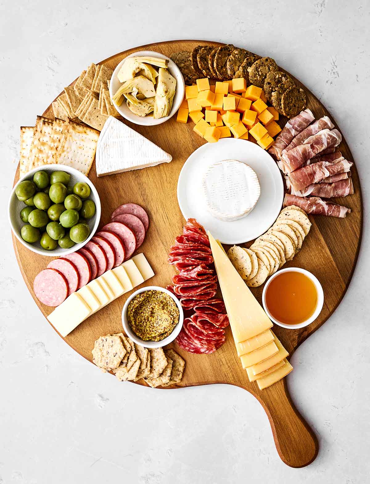 Step four of a charcuterie: Add crackers.