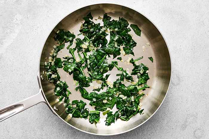Sauteed spinach in a pan.