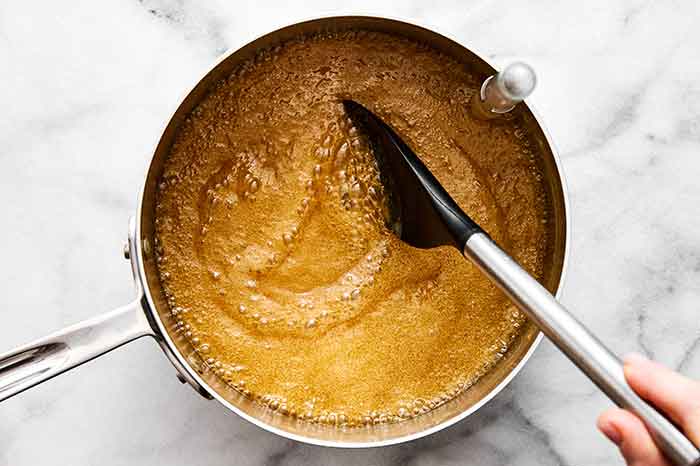 Step two of pecan pralines: Boil the maple mixture.