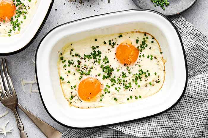 Shirred eggs in a ramekin.