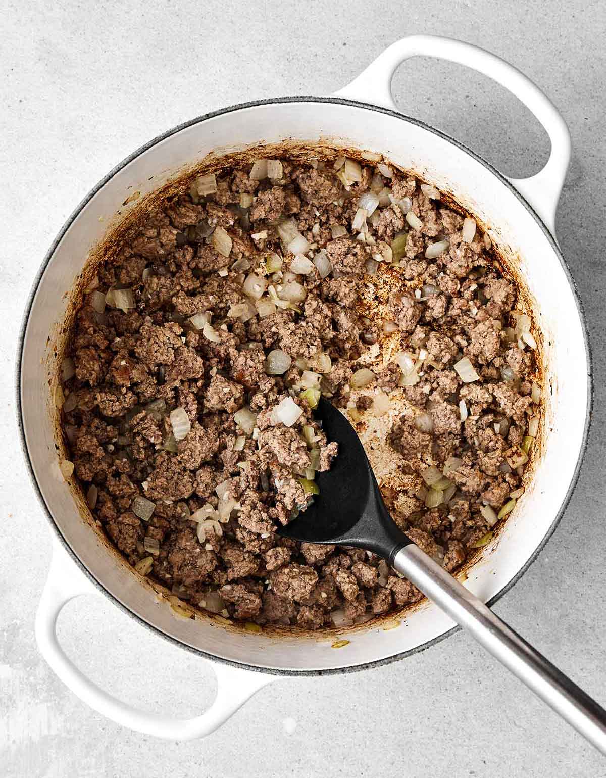 Step one of cabbage roll soup: cook ground beef.