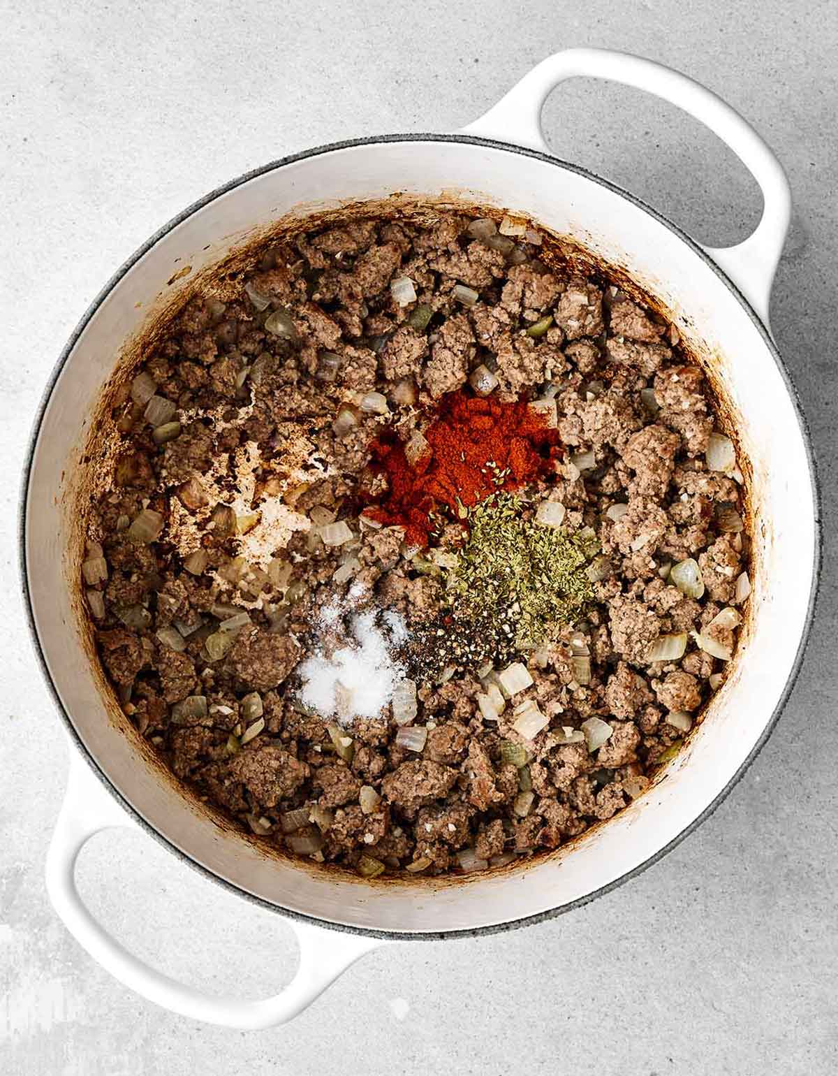 Step two of cabbage roll soup: add seasoning.