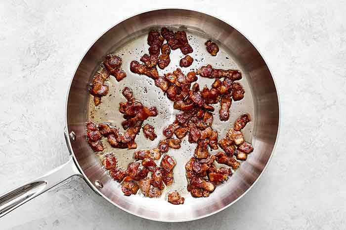 Step one of pea salad: cook bacon.