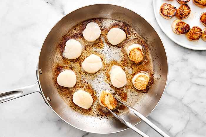 Step two of seared scallops: sear the scallops.