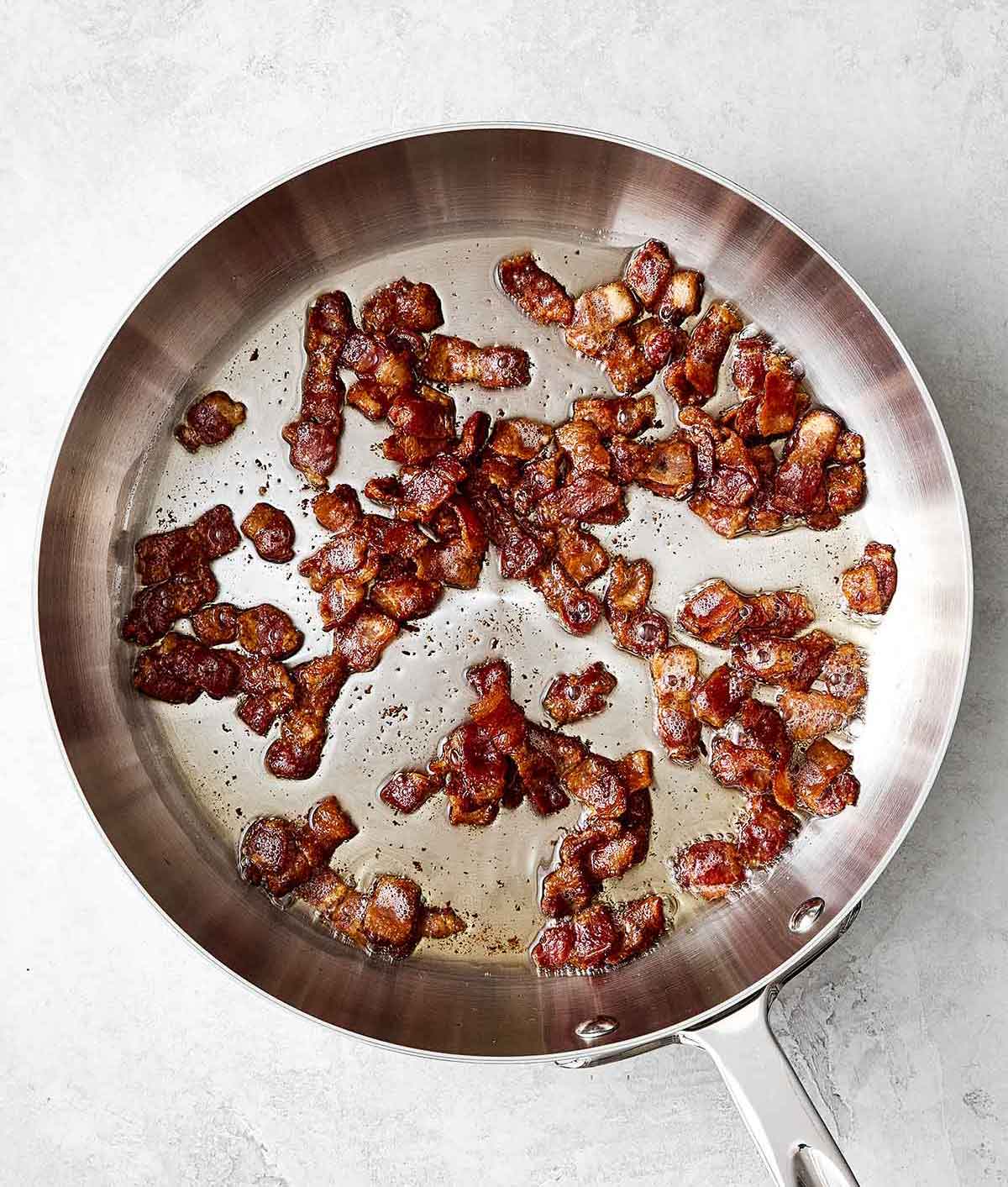 This creamy pea salad has become a spring and summer staple! It's simple, flavorful, and perfect for potlucks and group gatherings. Step one of pea salad: cook bacon.