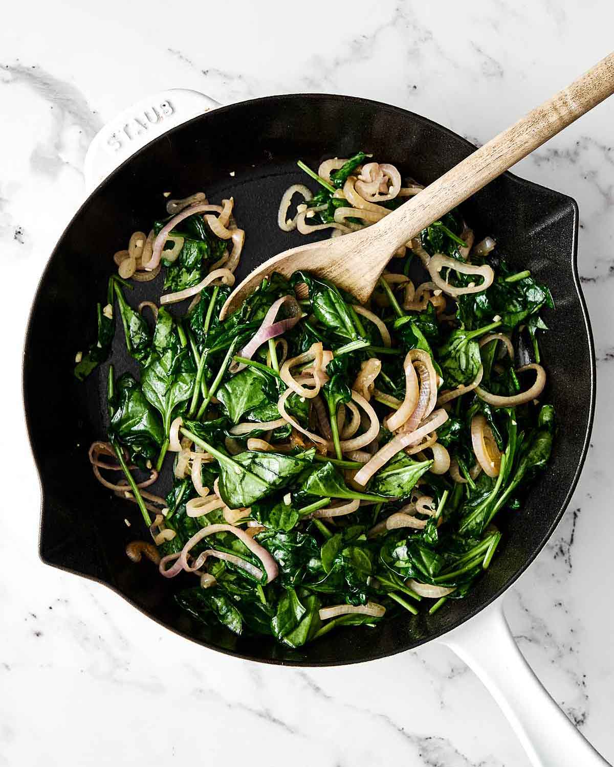 Step two of crustless quiche: cook the veggies.