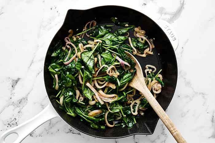 Step two of crustless quiche: cook the veggies.