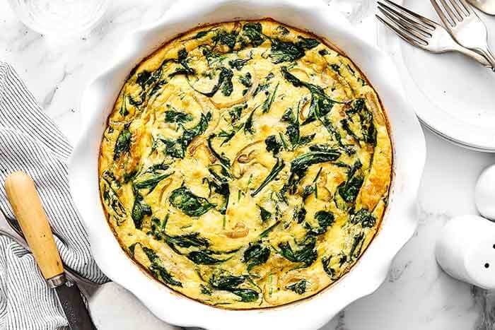 Step five of crustless quiche: bake the quiche.