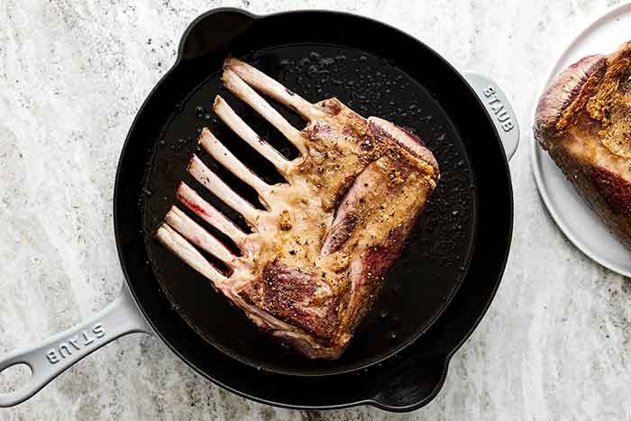 Step two of rack of lamb: sear the lamb.