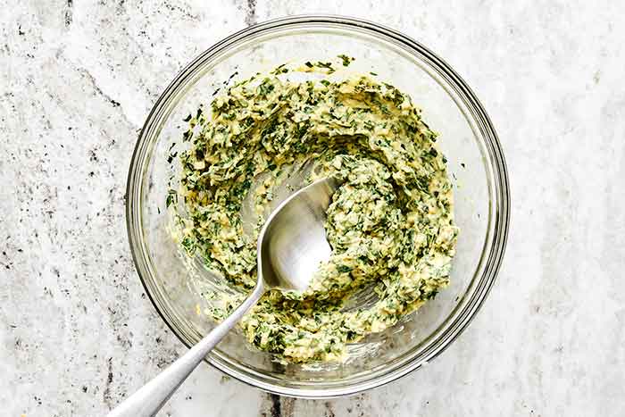 Step three of rack of lamb: make herb butter.