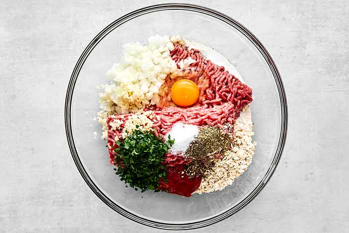 Step one of meatloaf muffins: Mix the meatloaf.