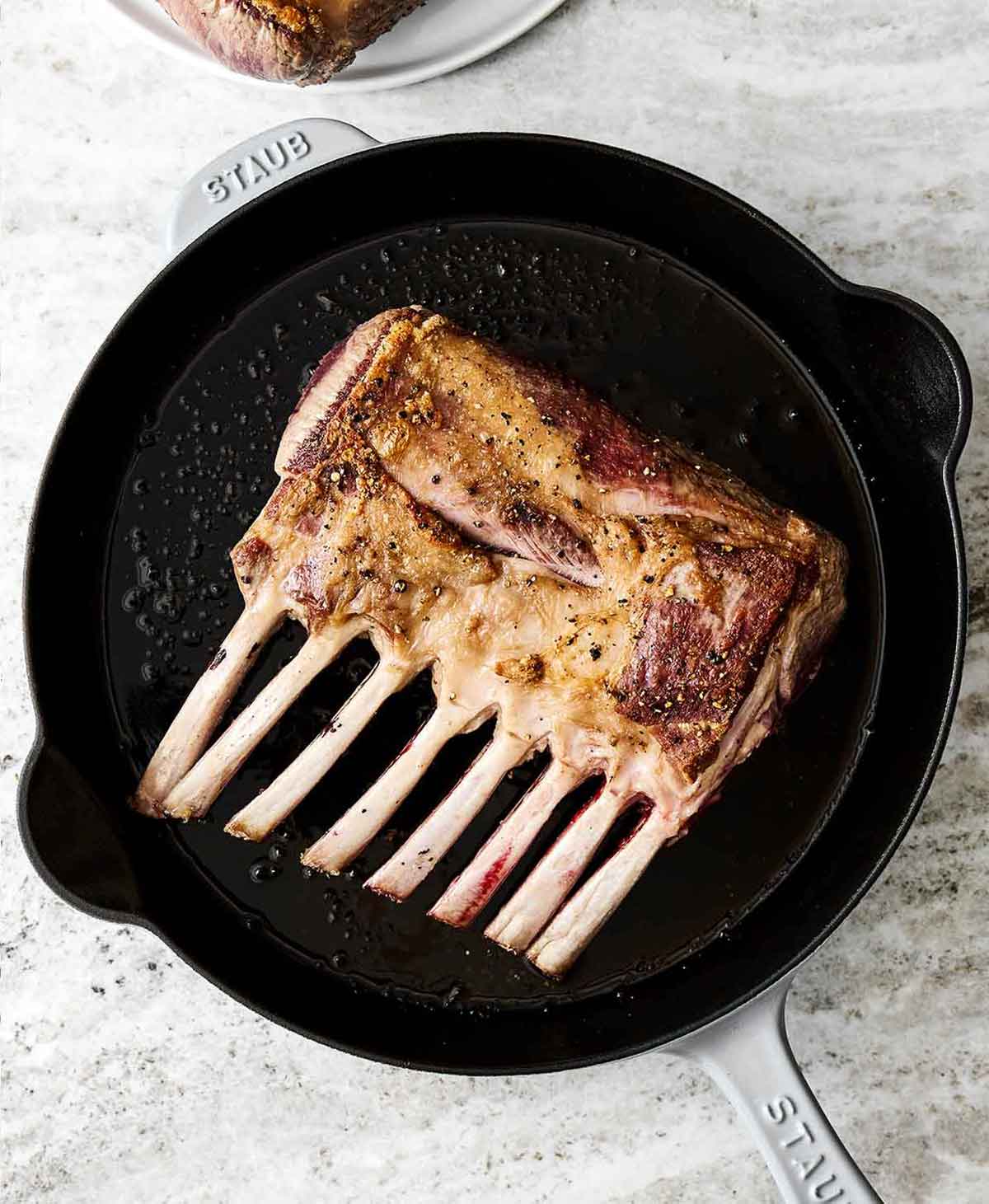 Step two of rack of lamb: sear the lamb.