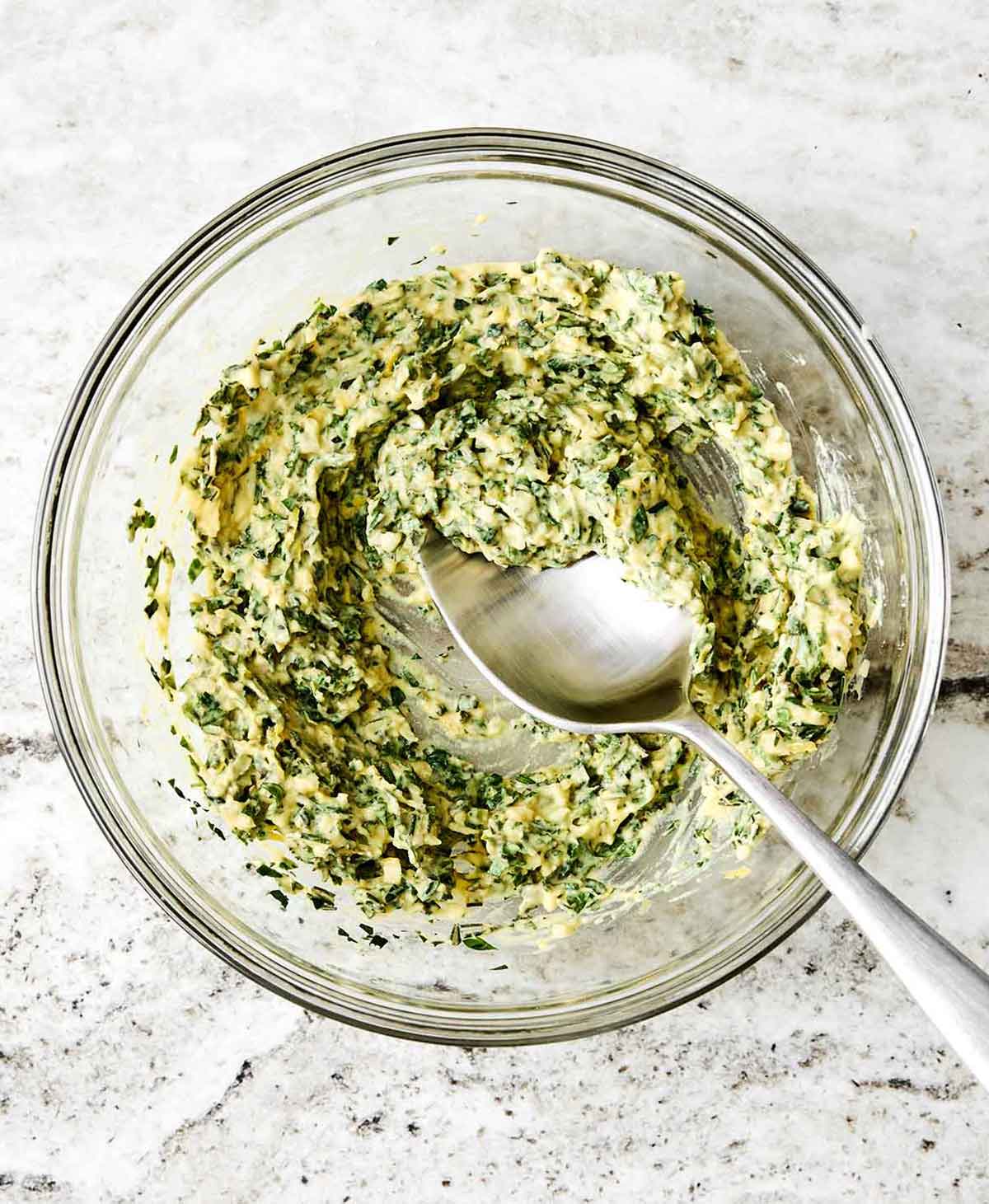 Step three of rack of lamb: make herb butter.