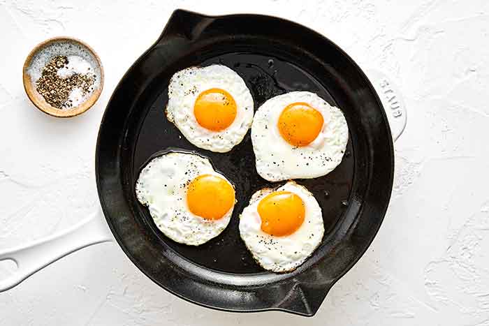 Step four of chilaquiles: fry eggs.