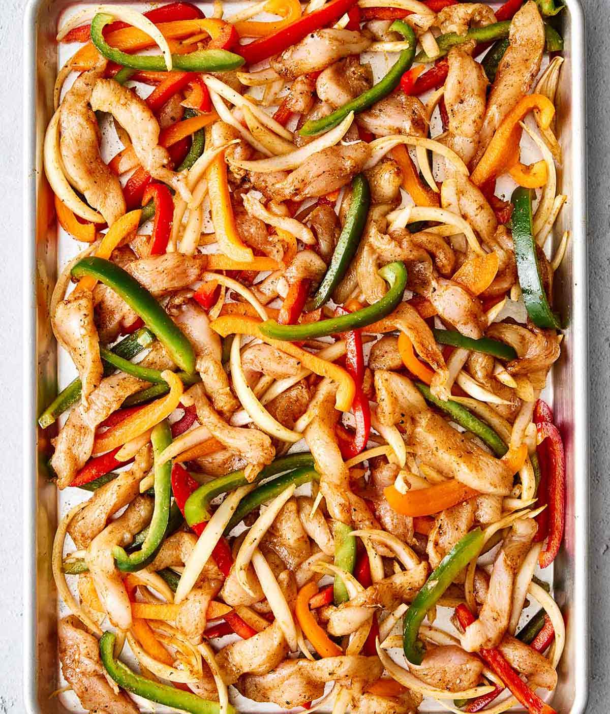 Step three of sheet pan chicken fajitas: bake in oven.