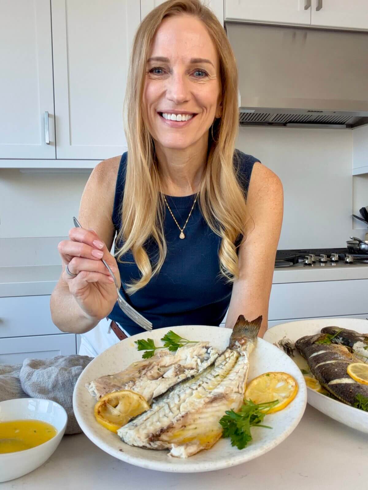 Lisa testing a whole roasted branzino recipe.
