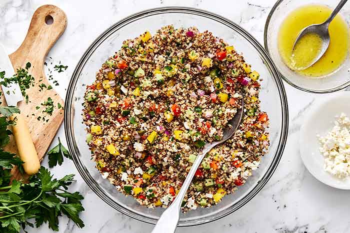 Mixed Mediterranean quinoa salad in a bowl.