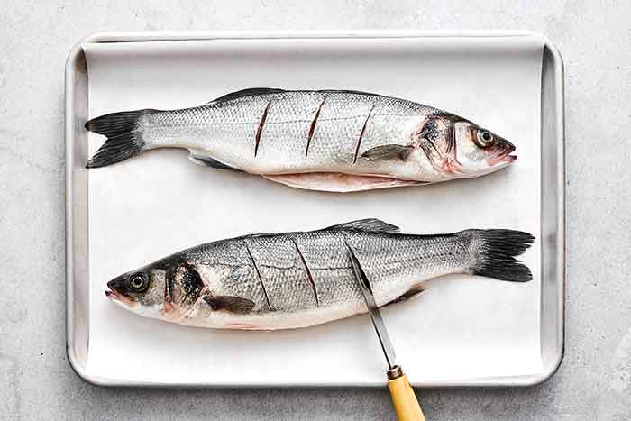Slicing branzino before roasting.