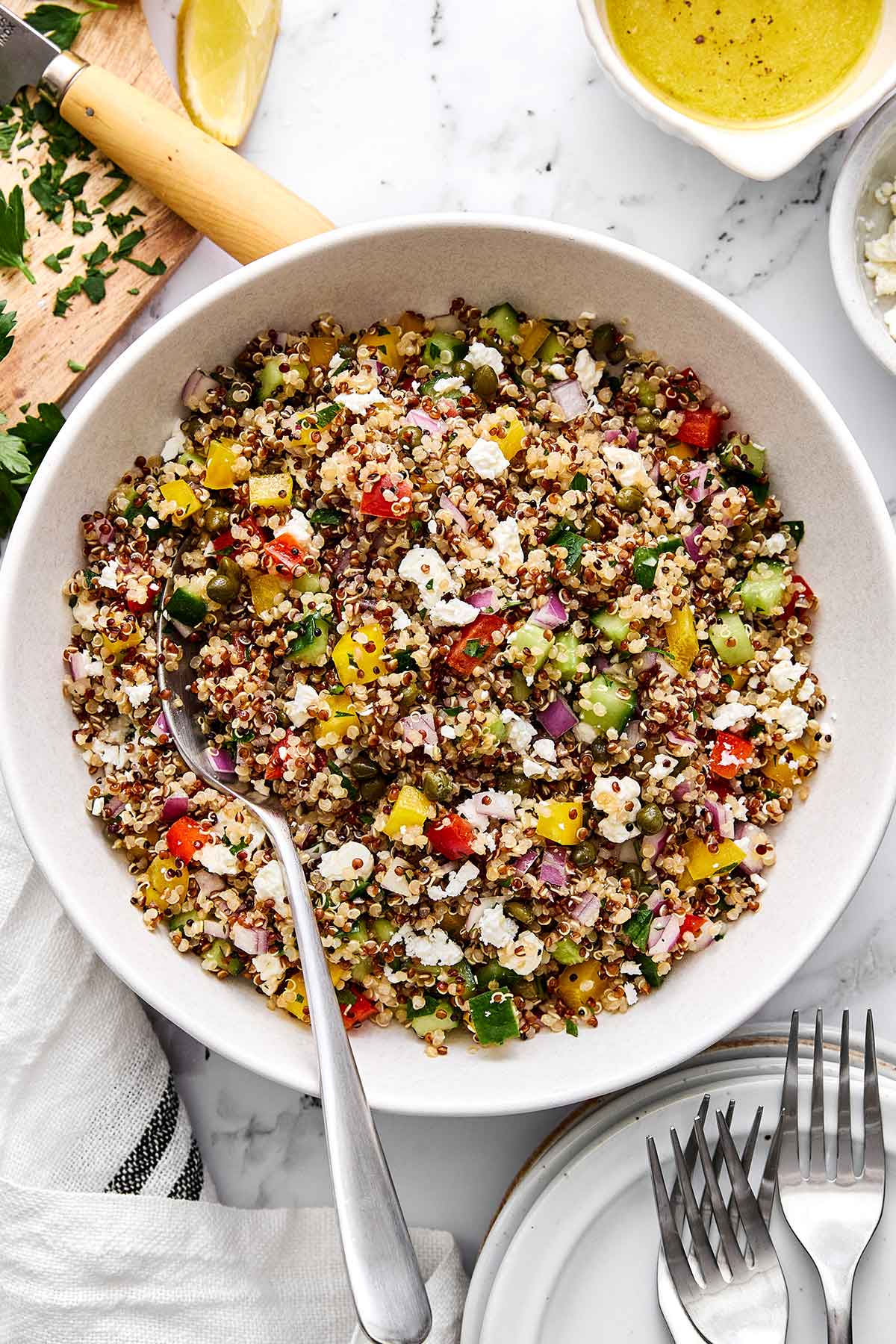 This is the Mediterranean quinoa salad I always make! It hits the perfect balance of fresh, briny, and satisfying...and it hold up well. Mediterranean quinoa salad in a bowl.