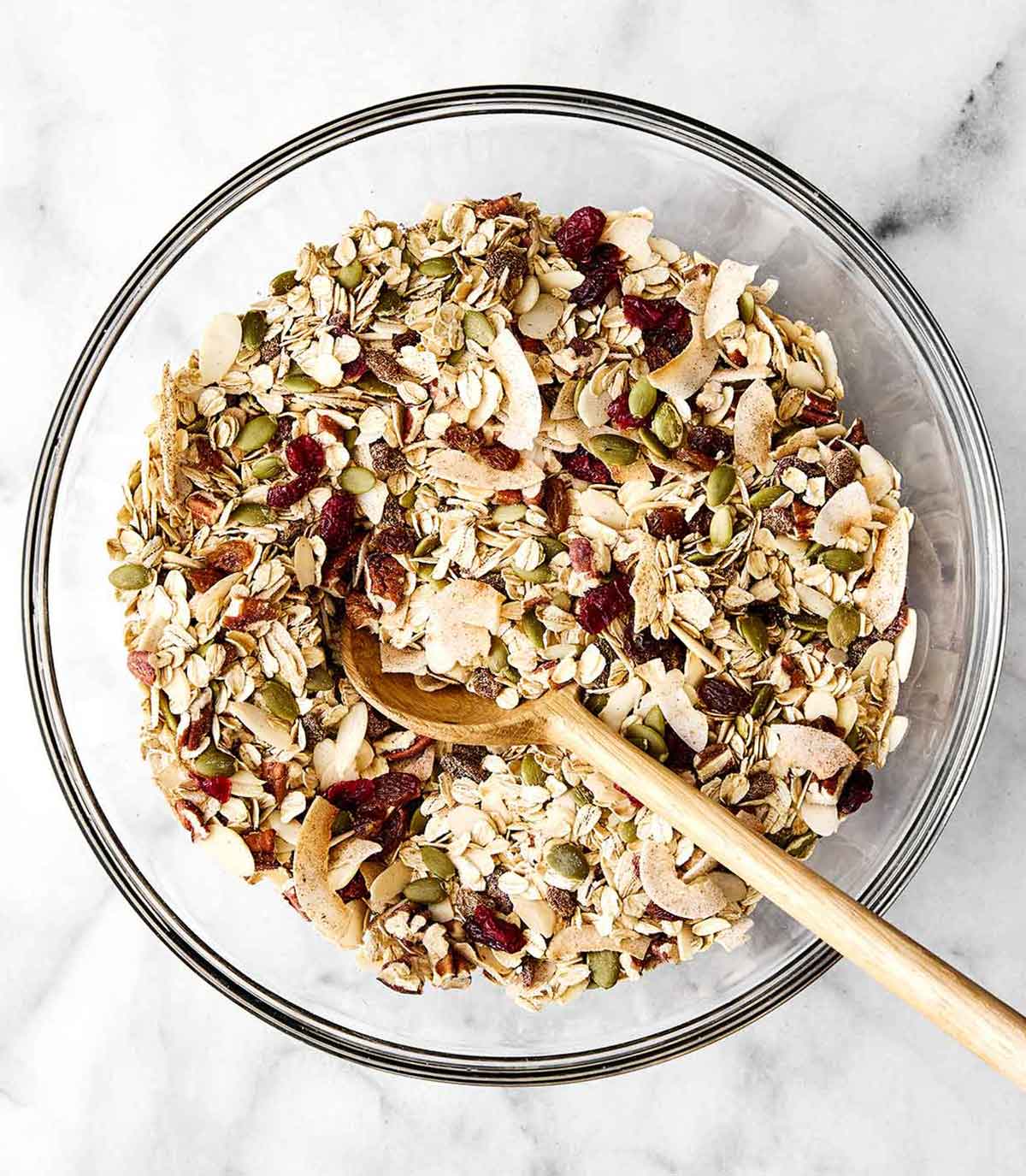 Mixing muesli in a bowl.