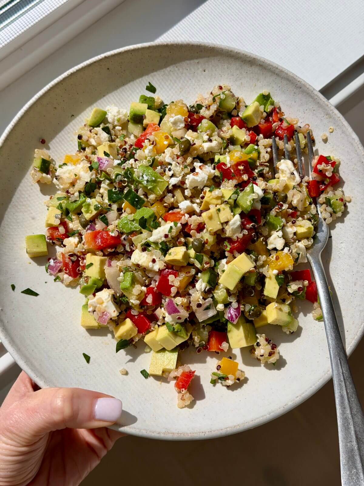Lisa Bryan testing Mediterranean quinoa salad.