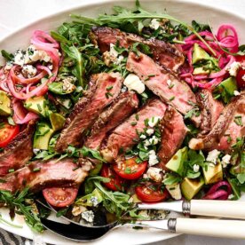 Steak salad recipe in a platter.