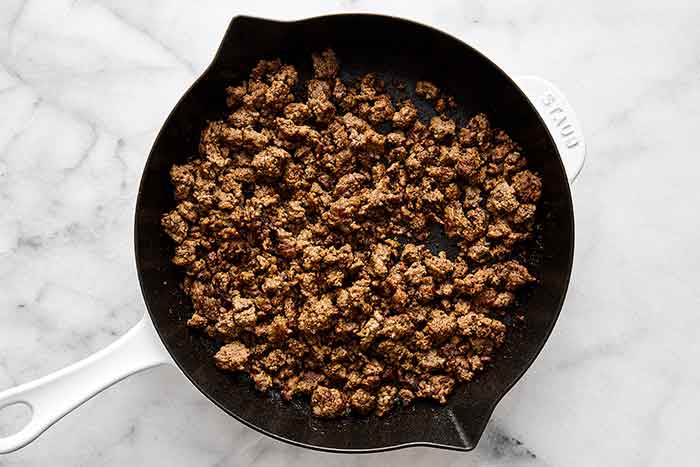 Cooking ground beef in a pan.