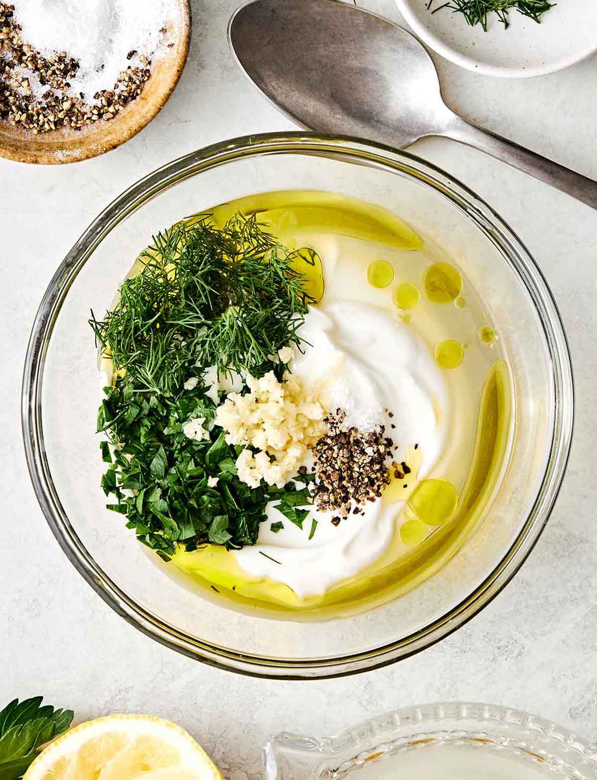 Lemon dill yogurt sauce ingredients in a bowl.