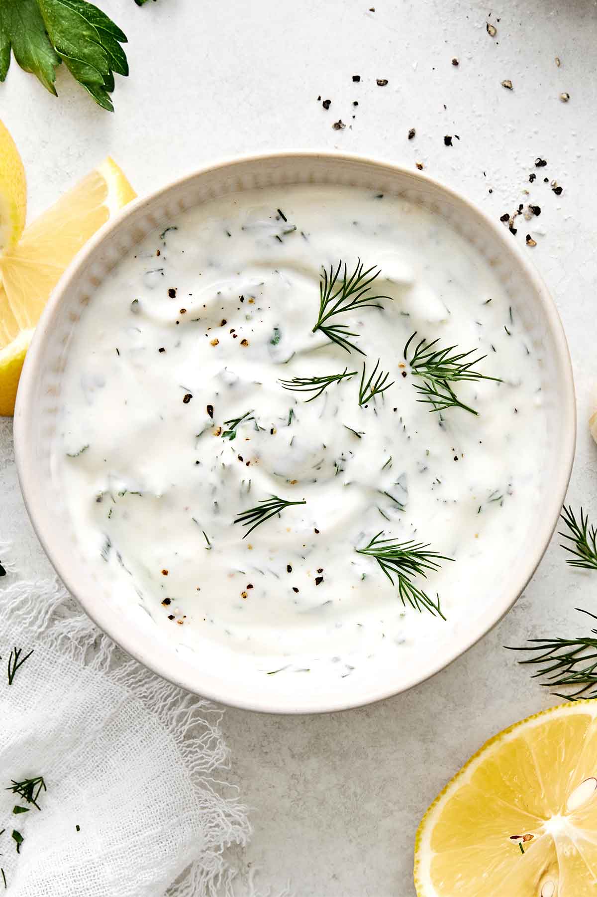 Lemon dill yogurt sauce in a bowl.