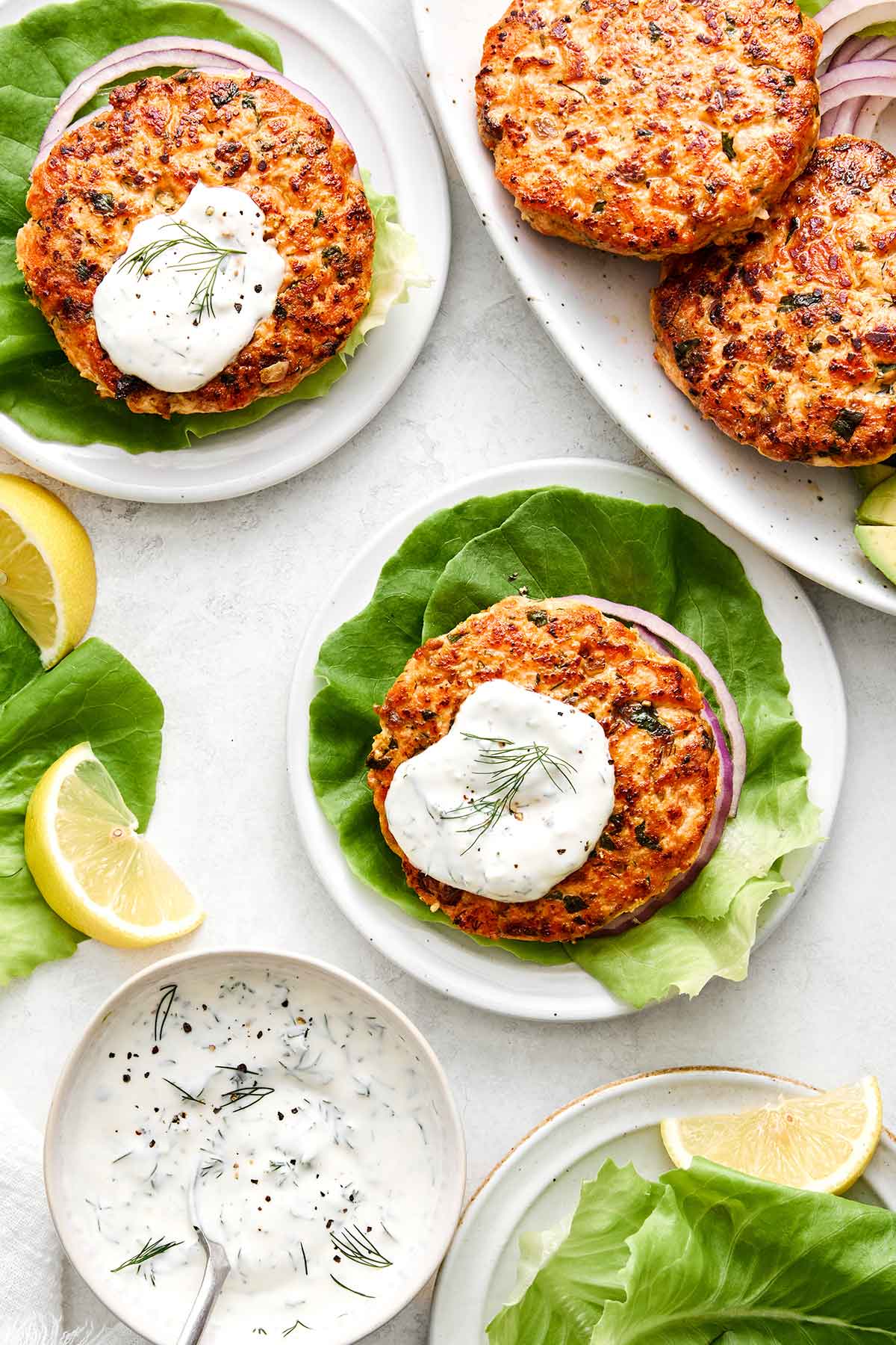 Salmon burgers with lemon dill yogurt sauce.