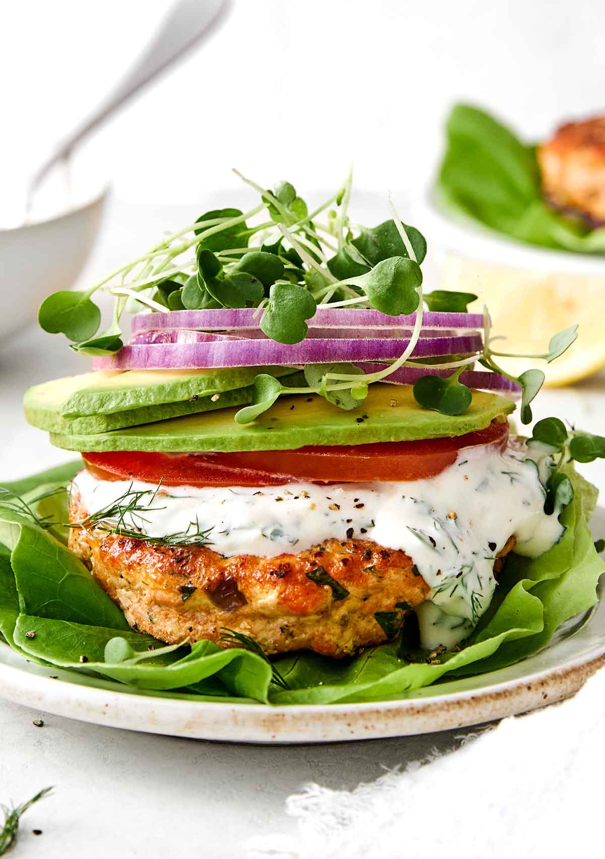 Salmon burger with toppings.