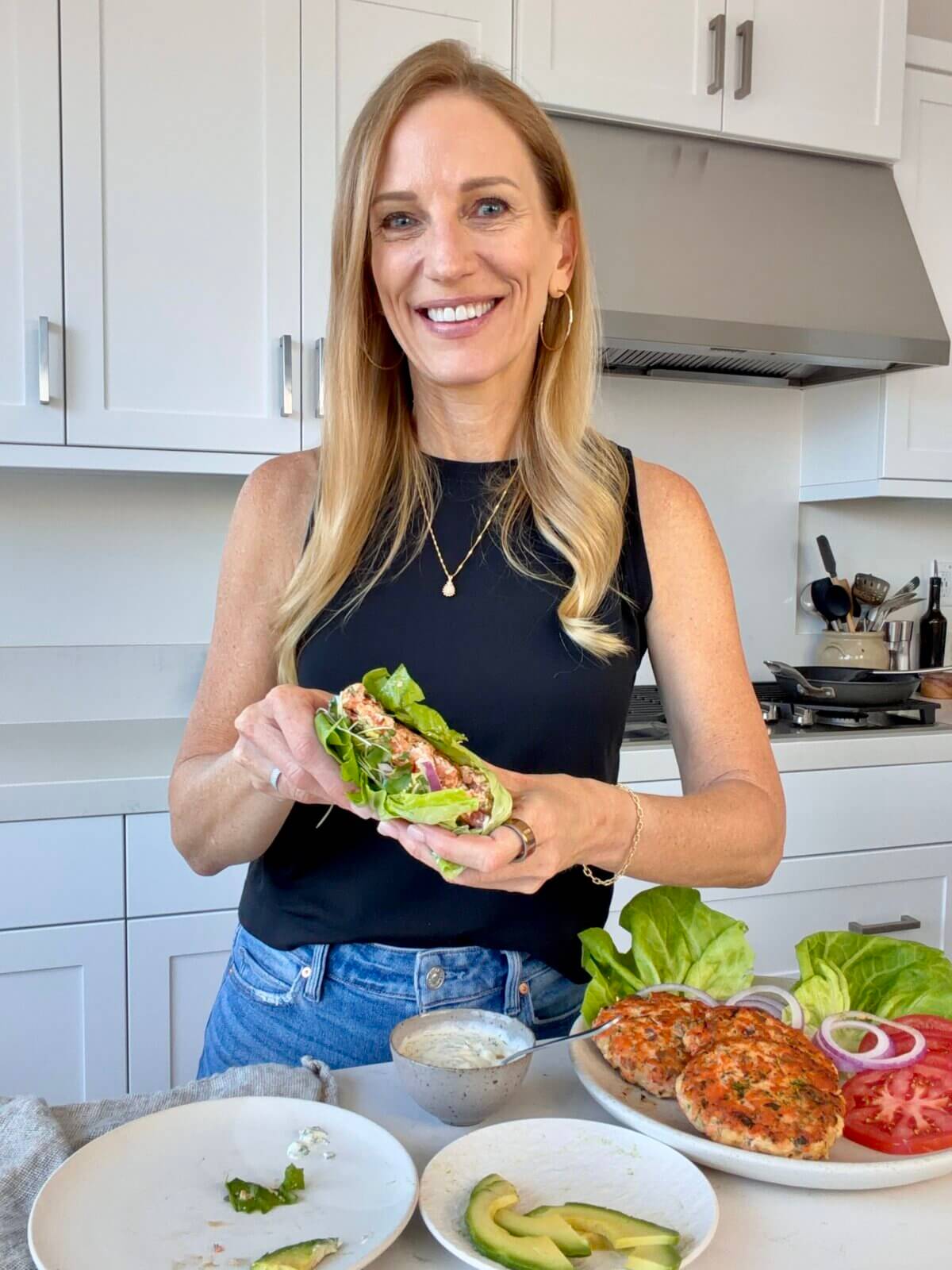 Lisa making salmon burgers.