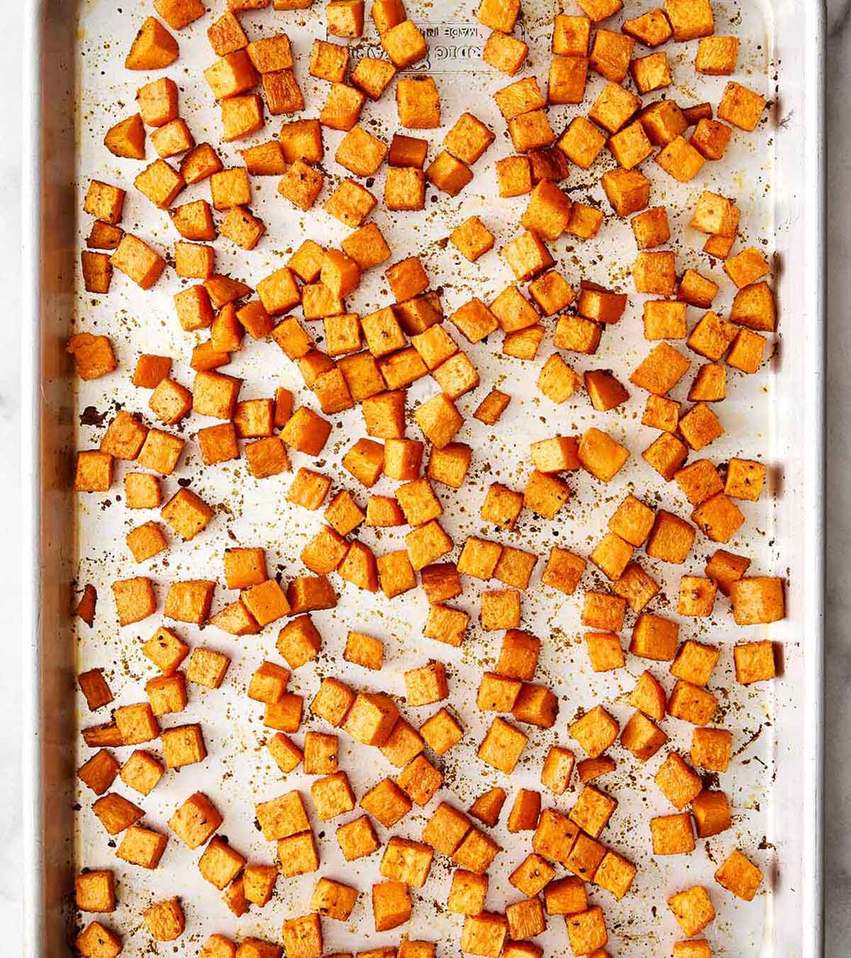 This sweet potato burger bowl is the best kind of weeknight dinner. It's all the tasty layers of an In-N-Out burger, but leans healthier! Roasted sweet potatoes on a sheet pan.