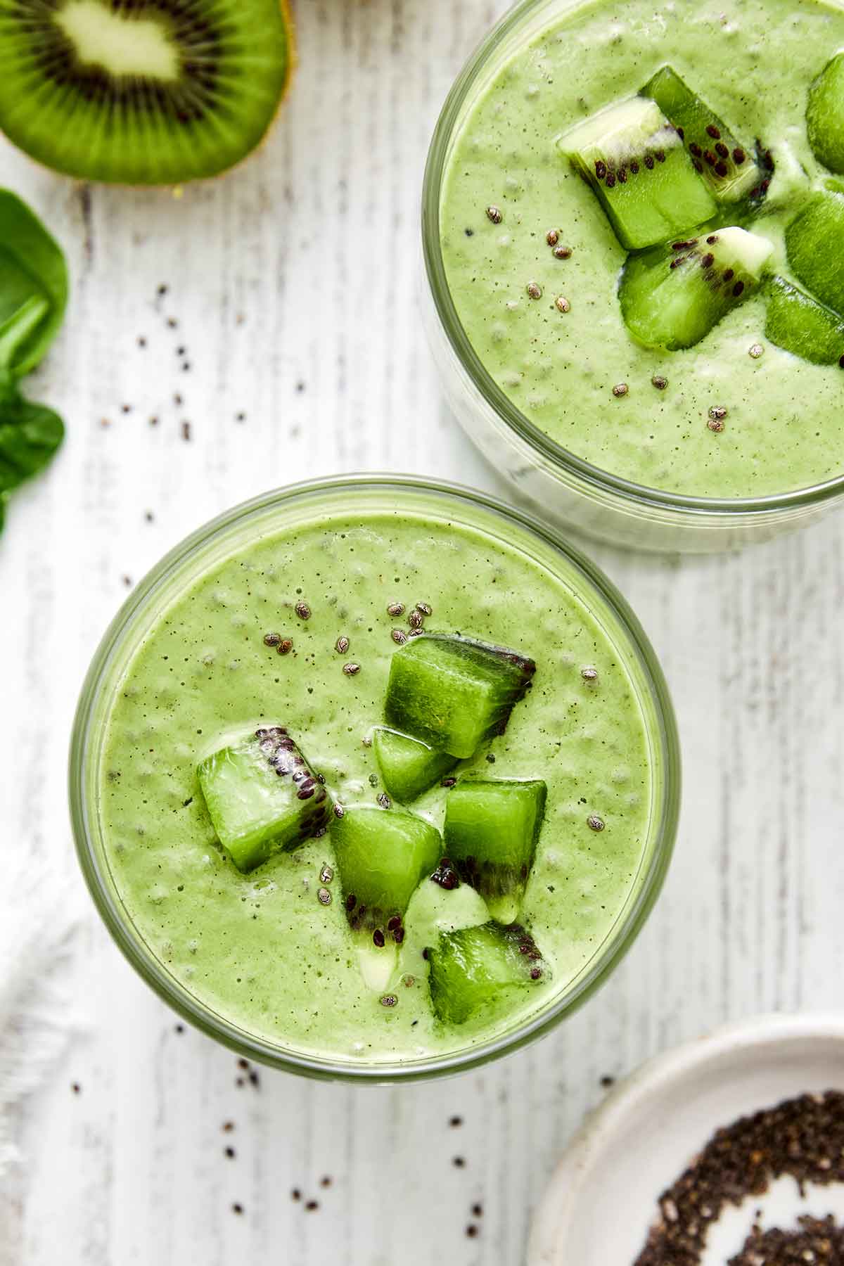 The kiwi breakfast smoothie is a nutritional powerhouse, perfectly filling, and so delicious. The perfect way to start your mornings! Kiwi smoothies in cups.