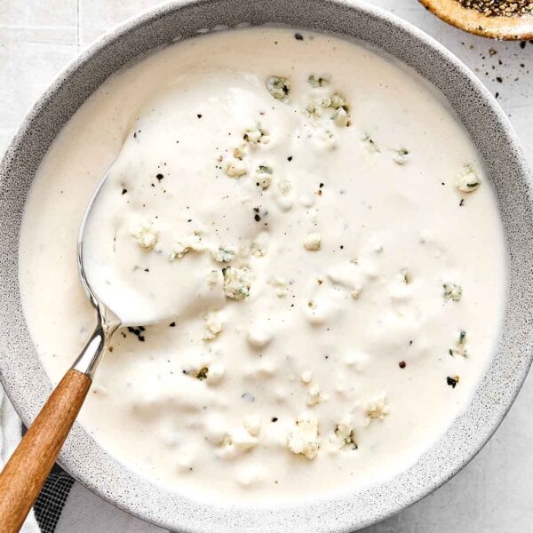 A bowl of blue cheese dressing.