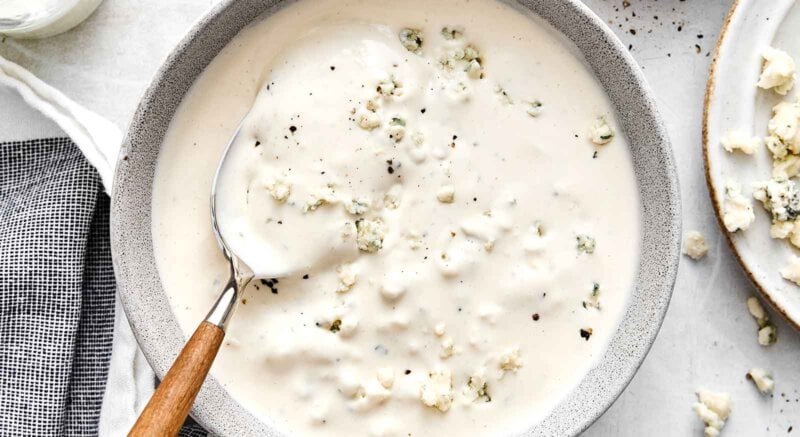 A bowl of blue cheese dressing.