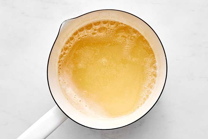 Boiling honey for a baked Alaska.
