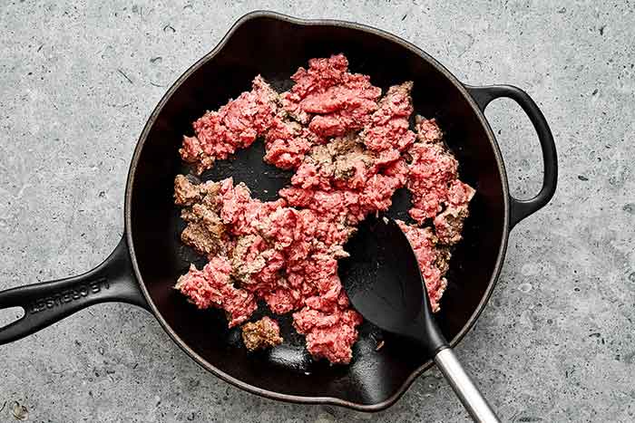 Cooking ground beef in a skillet.