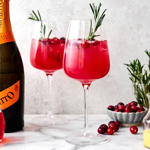 Two glasses of cranberry spritz cocktail.