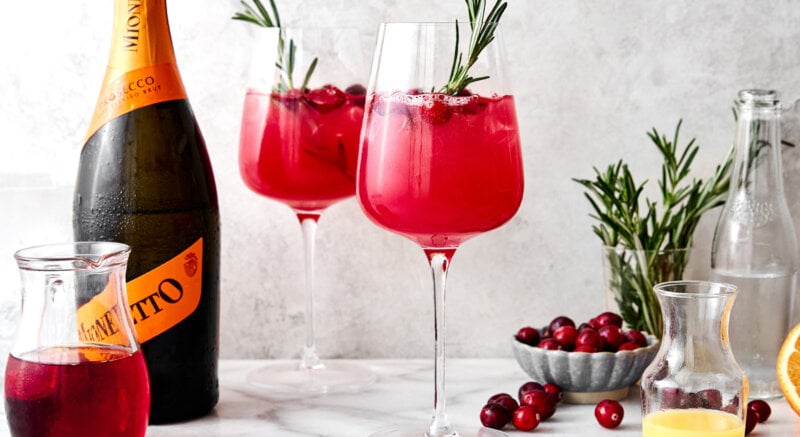 Two glasses of cranberry spritz cocktail.